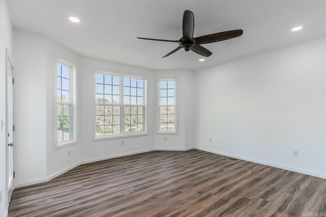 unfurnished room featuring ceiling fan and dark hardwood / wood-style floors