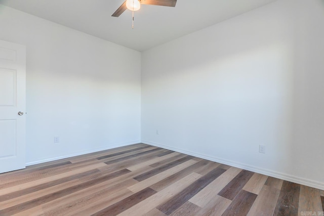 unfurnished room featuring ceiling fan and hardwood / wood-style floors