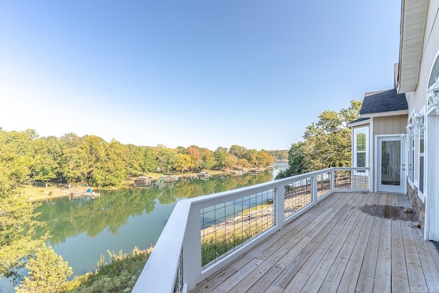 wooden deck featuring a water view