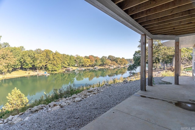 view of patio with a water view