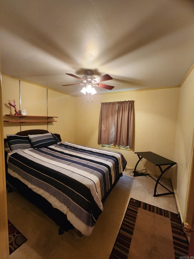 bedroom featuring ceiling fan and light carpet