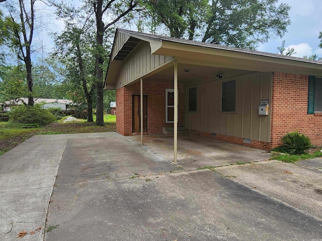 view of home's exterior with a carport