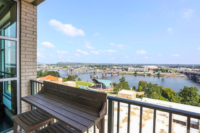 balcony featuring a water view