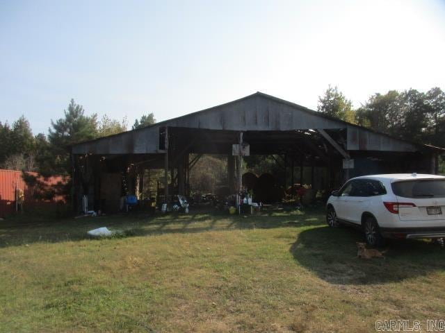 exterior space with a yard and a carport