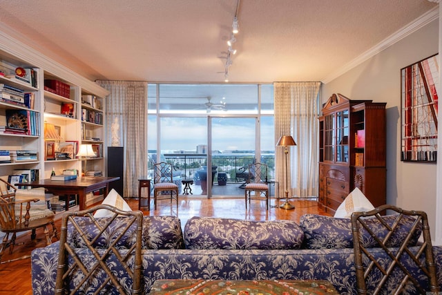 living room featuring ceiling fan, floor to ceiling windows, parquet flooring, ornamental molding, and a textured ceiling