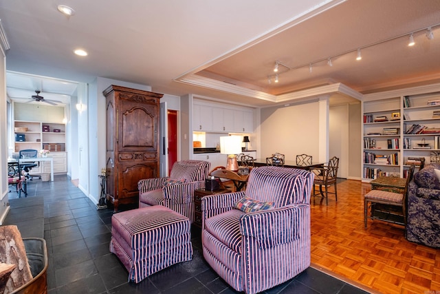 living room featuring parquet flooring, ceiling fan, and ornamental molding