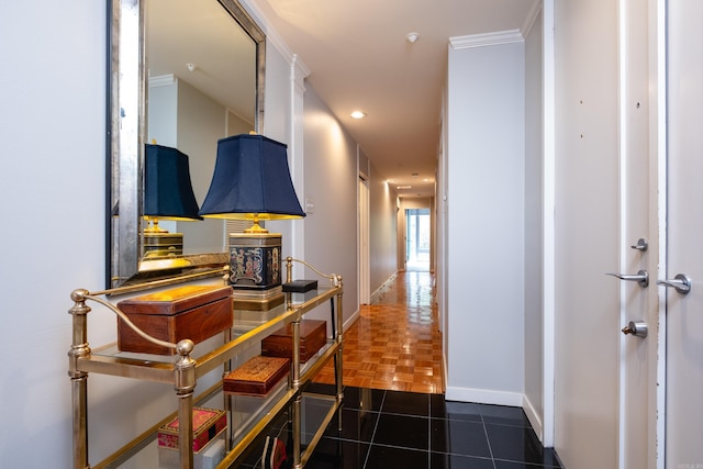 corridor with dark parquet floors and ornamental molding