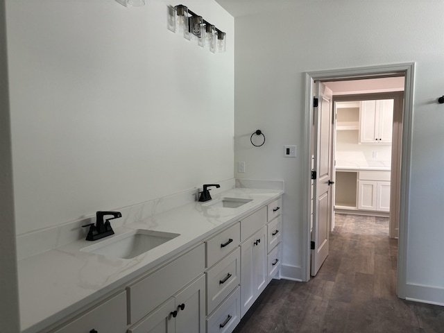 bathroom with vanity and hardwood / wood-style floors