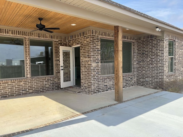 exterior space featuring ceiling fan