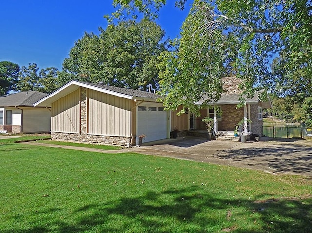 single story home featuring a garage and a front lawn