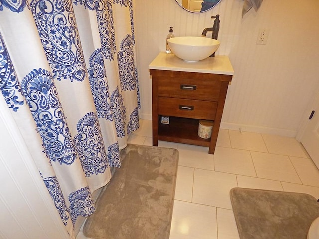 bathroom with tile patterned floors and vanity