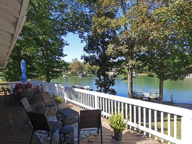 wooden terrace with a water view