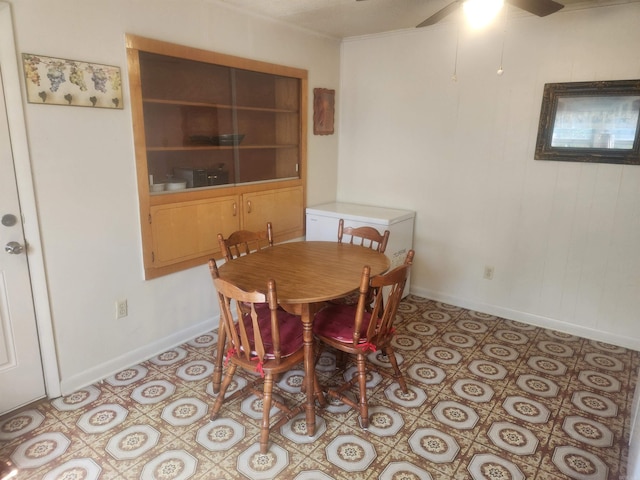 dining room featuring light tile patterned floors and ceiling fan