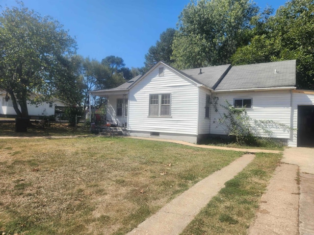 view of side of home featuring a lawn