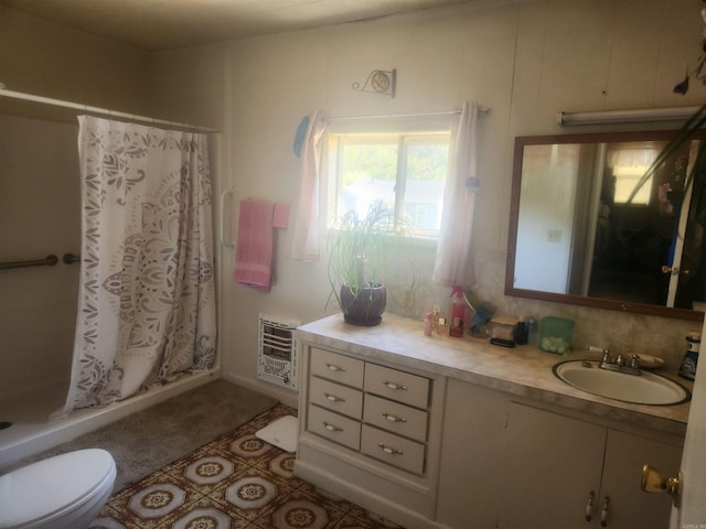 bathroom with walk in shower, toilet, heating unit, decorative backsplash, and vanity