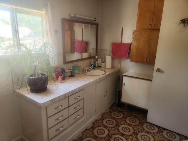 bathroom featuring decorative backsplash and vanity