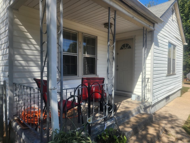 property entrance featuring covered porch