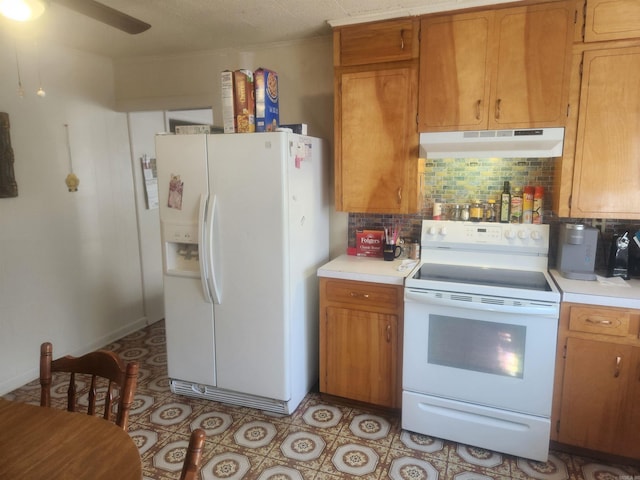 kitchen with ceiling fan, tasteful backsplash, and white appliances