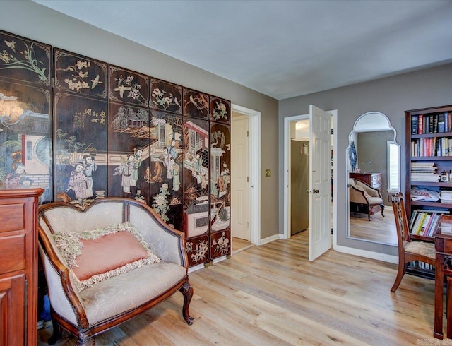 living area with light hardwood / wood-style floors