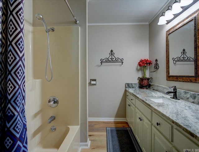 bathroom featuring wood-type flooring, crown molding, shower / bathtub combination with curtain, and vanity