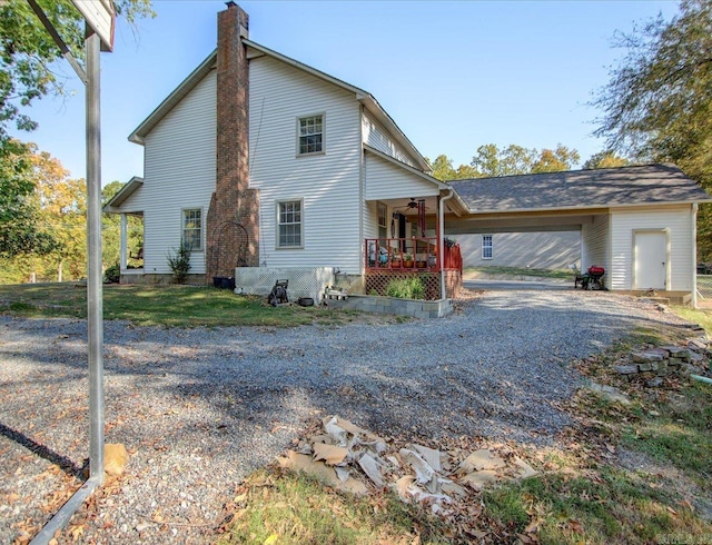 view of side of home with covered porch