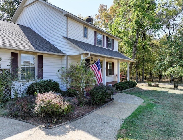 view of front of home with a front lawn and covered porch