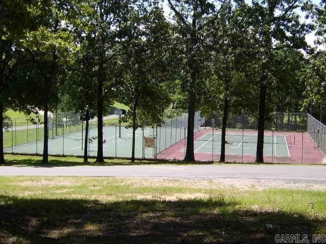 view of basketball court featuring tennis court