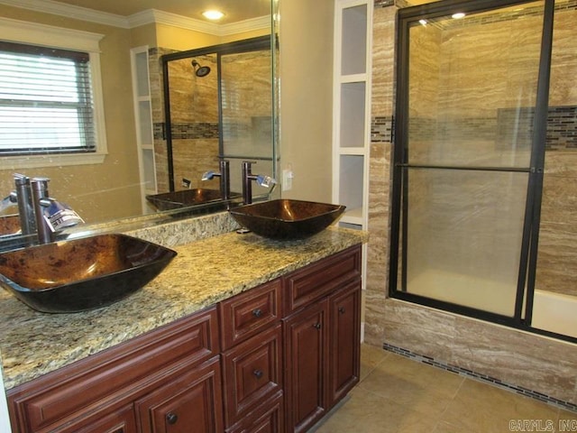 bathroom featuring an enclosed shower, ornamental molding, tile patterned floors, and vanity