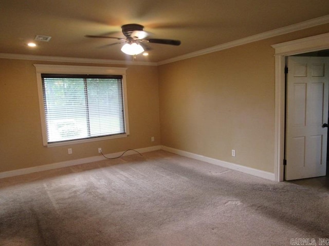 carpeted empty room with ornamental molding and ceiling fan