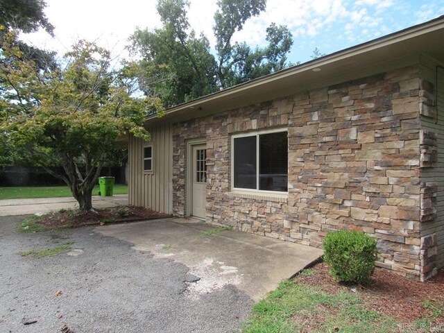 201 W Palm, Lonoke, AR 72086 - property entrance featuring stone siding