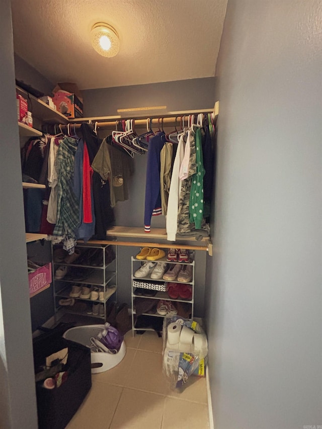 spacious closet with tile patterned flooring