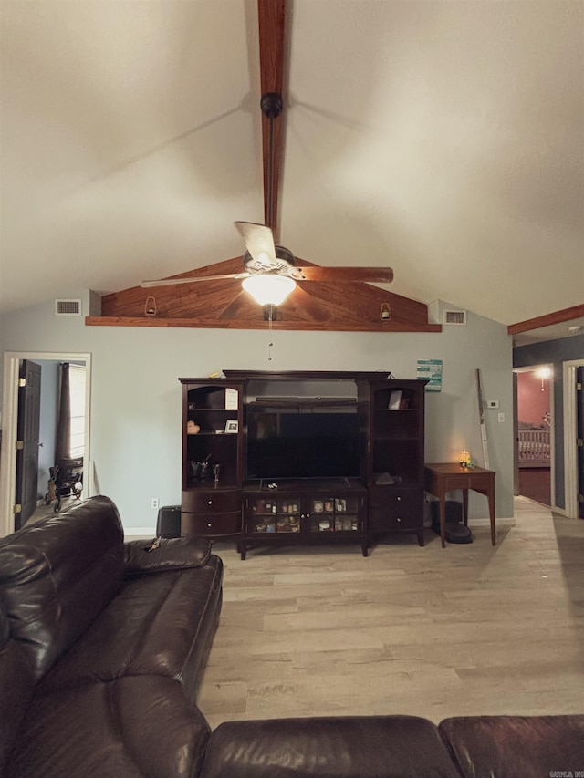 living room featuring lofted ceiling, ceiling fan, and light hardwood / wood-style floors