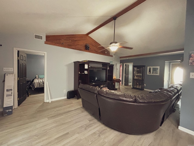 living room featuring ceiling fan, light wood-type flooring, and vaulted ceiling