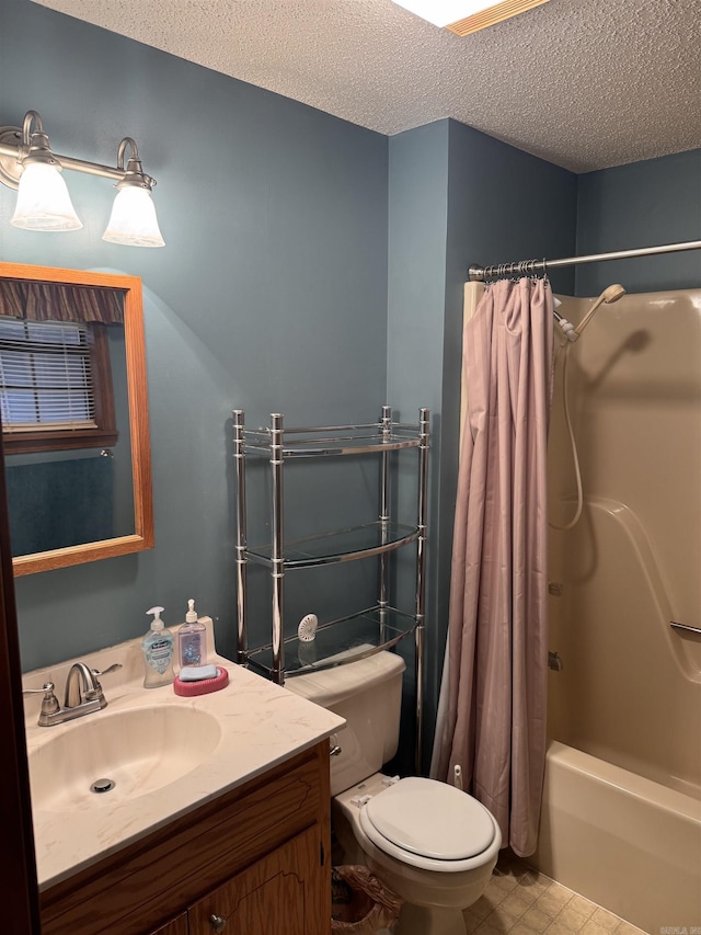 full bathroom with vanity, shower / bath combo, a textured ceiling, and toilet