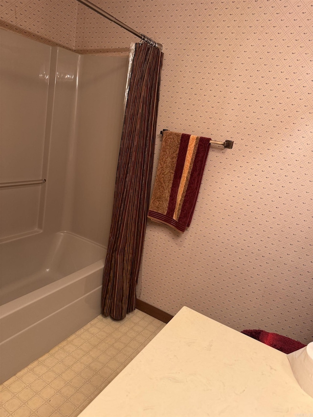 bathroom featuring shower / tub combo with curtain