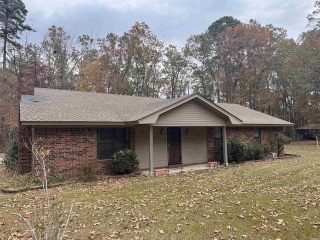 ranch-style house with a front lawn