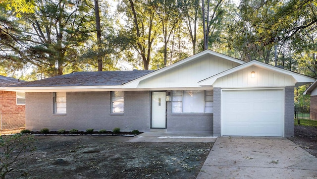 ranch-style home featuring a garage