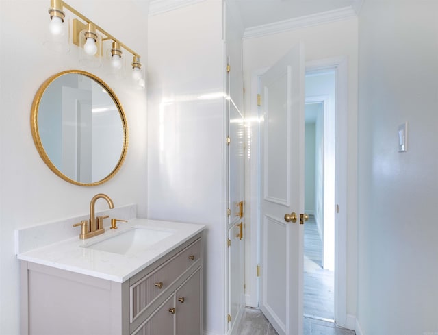 bathroom featuring vanity and ornamental molding