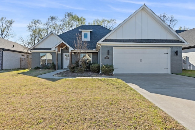 view of front of house featuring a garage and a front lawn