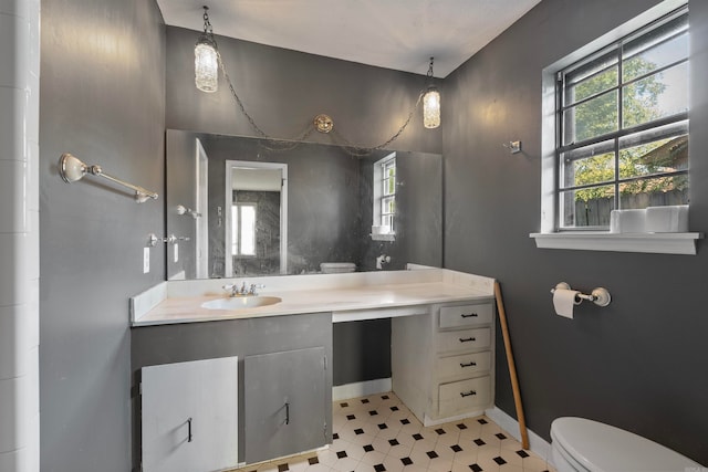 bathroom featuring vanity and toilet