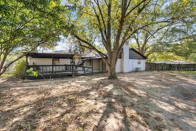 back of property featuring a deck