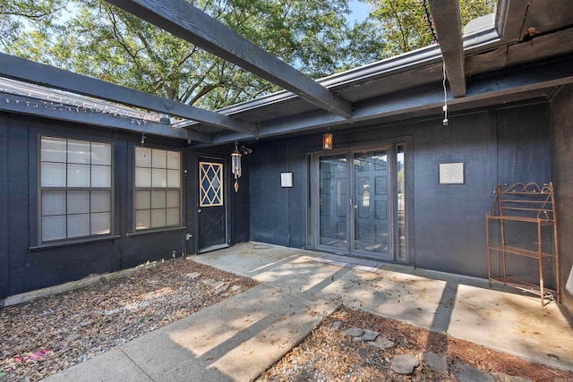 doorway to property with a patio area