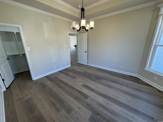 312 Forest Glen Cv, Jacksonville, AR 72076 - unfurnished dining area with crown molding, dark wood-style flooring, a notable chandelier, and baseboards