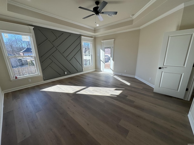 312 Forest Glen Cv, Jacksonville, AR 72076 - empty room with a tray ceiling, baseboards, dark wood-style floors, and a ceiling fan