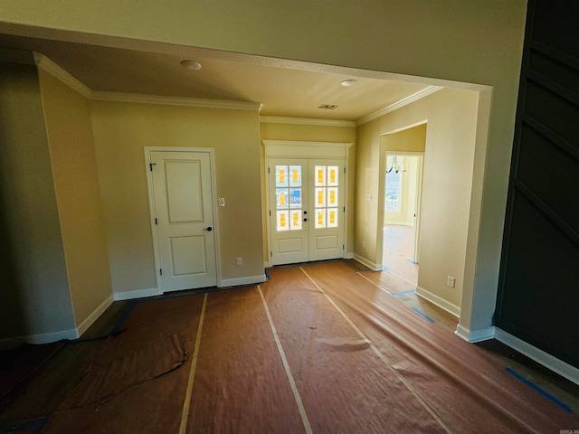 interior space with crown molding and french doors