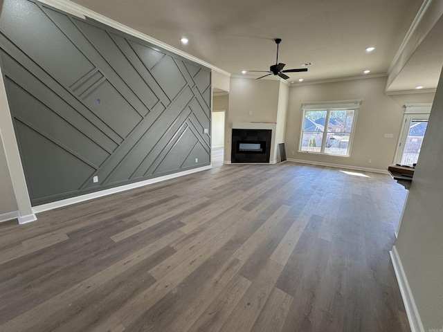 312 Forest Glen Cv, Jacksonville, AR 72076 - unfurnished living room with baseboards, a fireplace, crown molding, ceiling fan, and wood finished floors