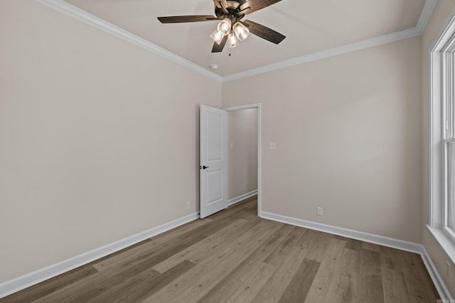 312 Forest Glen Cv, Jacksonville, AR 72076 - unfurnished room with crown molding, wood finished floors, baseboards, and a ceiling fan