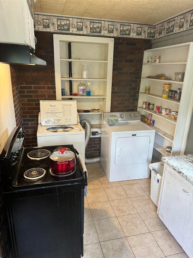 laundry room featuring light tile patterned floors