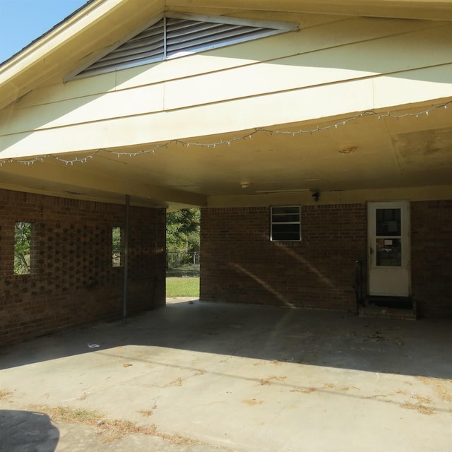 view of vehicle parking with a carport