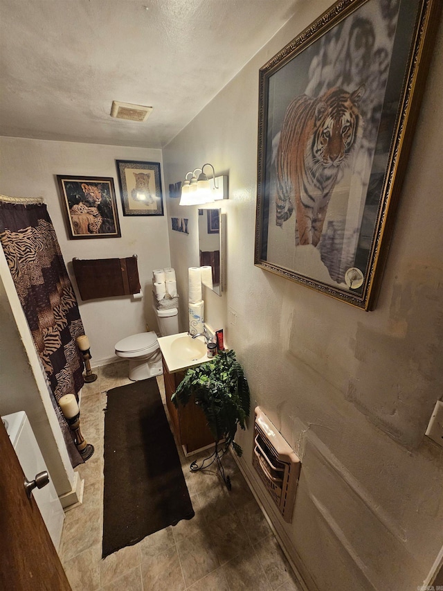 dining space featuring a textured ceiling and sink